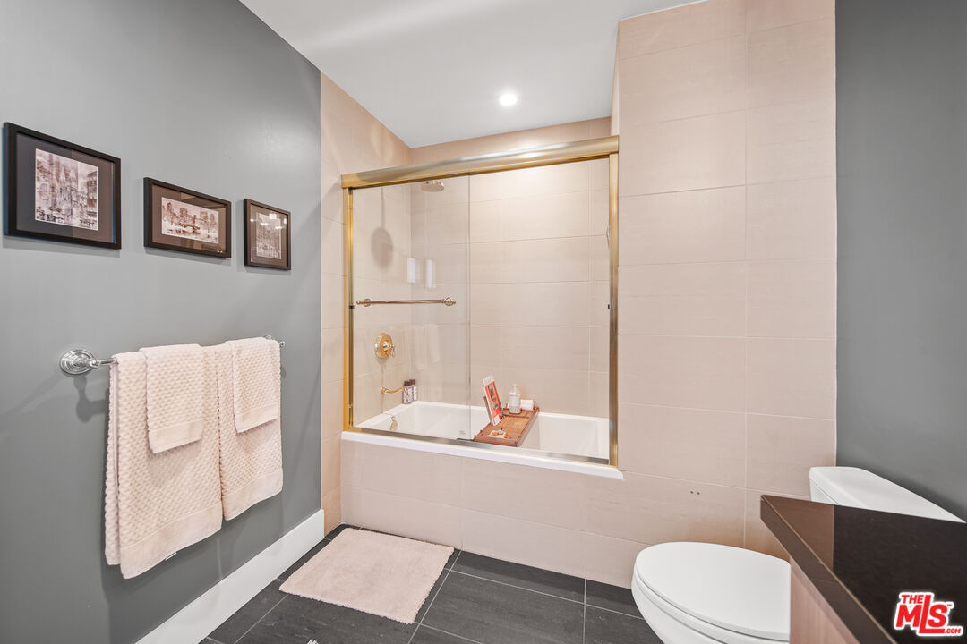 460 South Spring Street, Unit 1205 Los Angeles, CA 90013 - Photo 23 of 37 a bathroom with a toilet and a shower