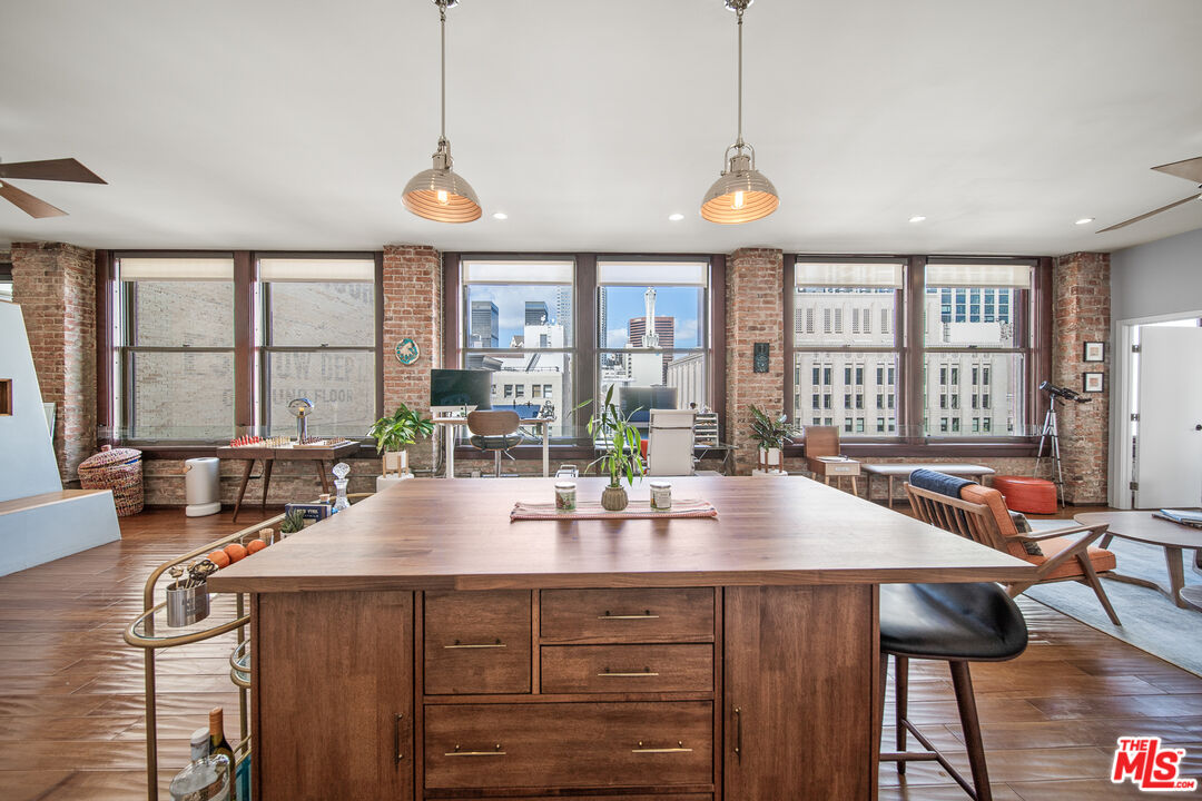 460 South Spring Street, Unit 1205 Los Angeles, CA 90013 - Photo 9 of 37 a view of a dining room with furniture window and outside view