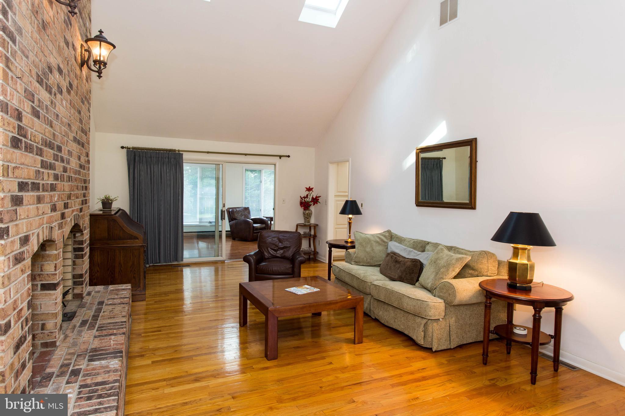 25 Coventry Road Rehoboth Beach, DE 19971 - Photo 4 of 25 Vaulted ceiling Great Room with Brick Fireplace