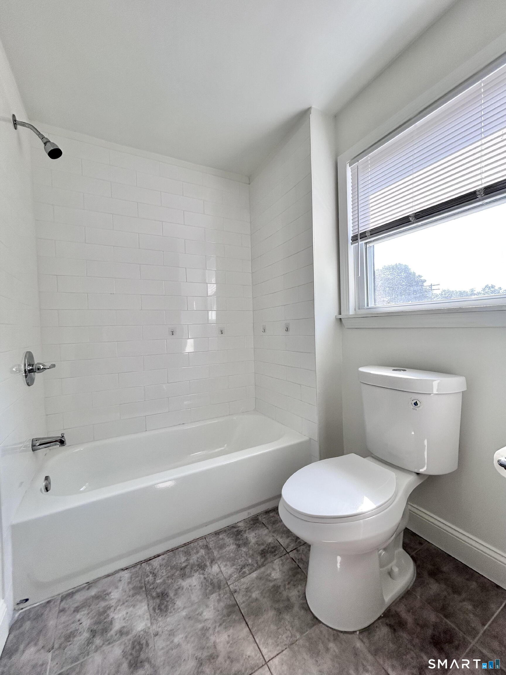 54 Roath Street Norwich, CT 06360 - Photo 16 of 16 a bathroom with a toilet and a bathtub