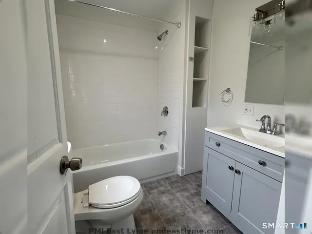 a bathroom with a sink toilet and a bathtub