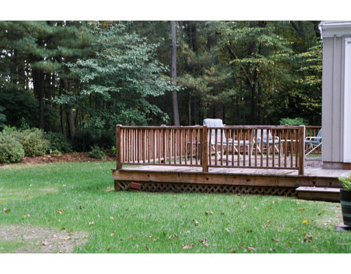 61 Hillcrest Road Concord, MA 01742 - Photo 4 of 11 a view of a yard with a wooden fence