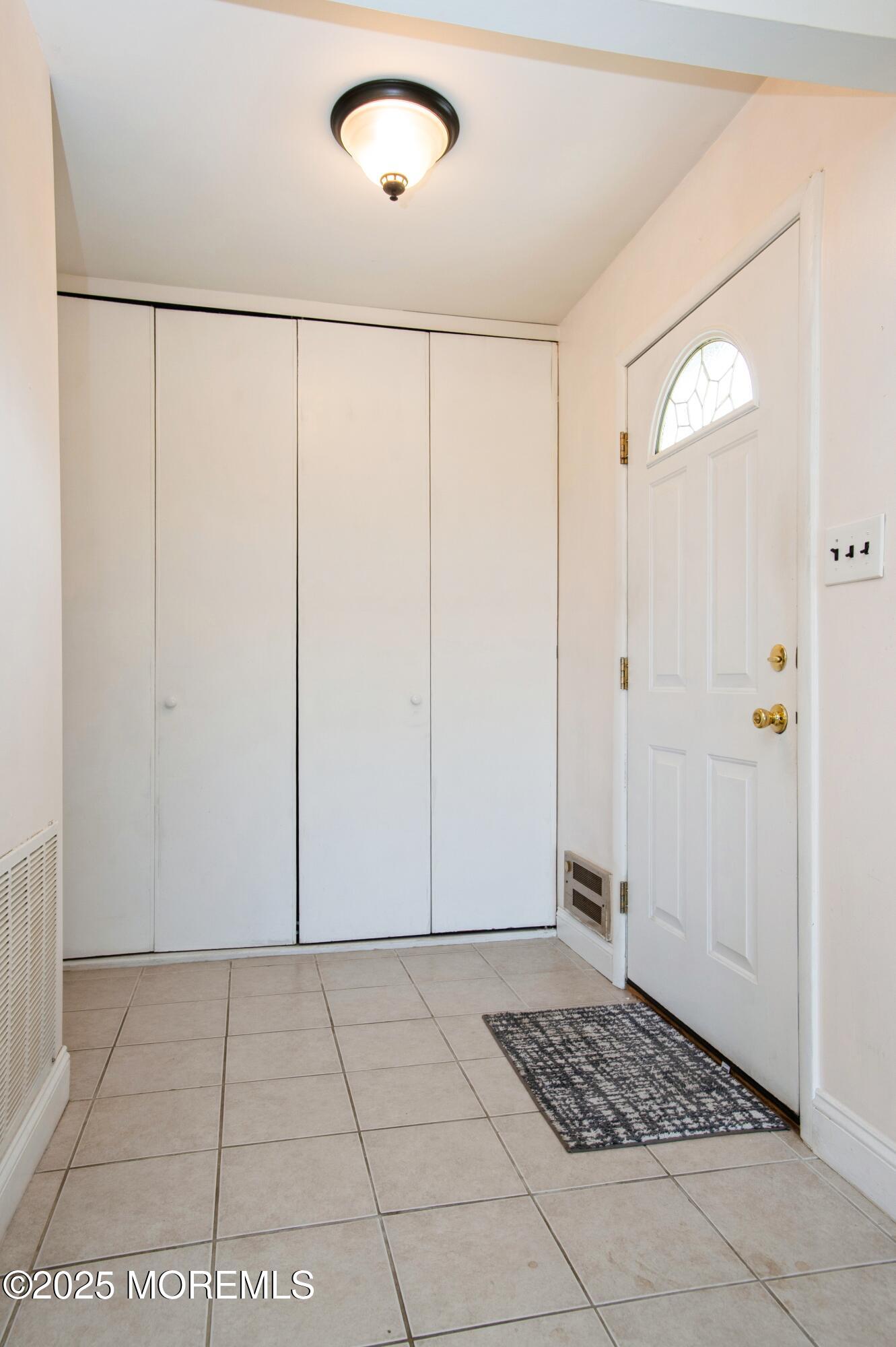 48 Watkins Road Brick, NJ 08724 - Photo 4 of 25 04_48WatkinsRd_32001_Foyer_HiRes