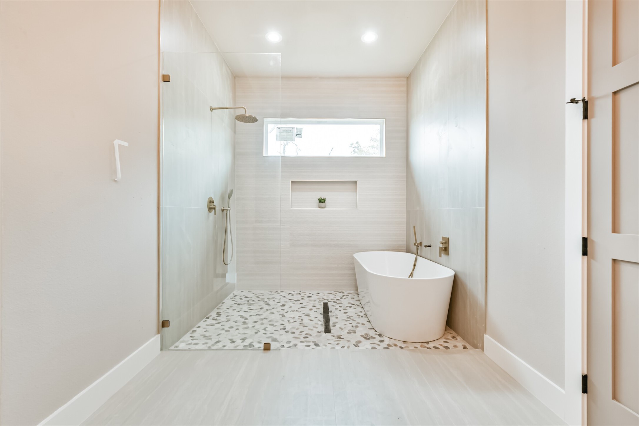 250 Pony Trail Angleton, TX 77515 - Photo 11 of 32 Luxurious spa-like master bathroom with elegant finishes.
