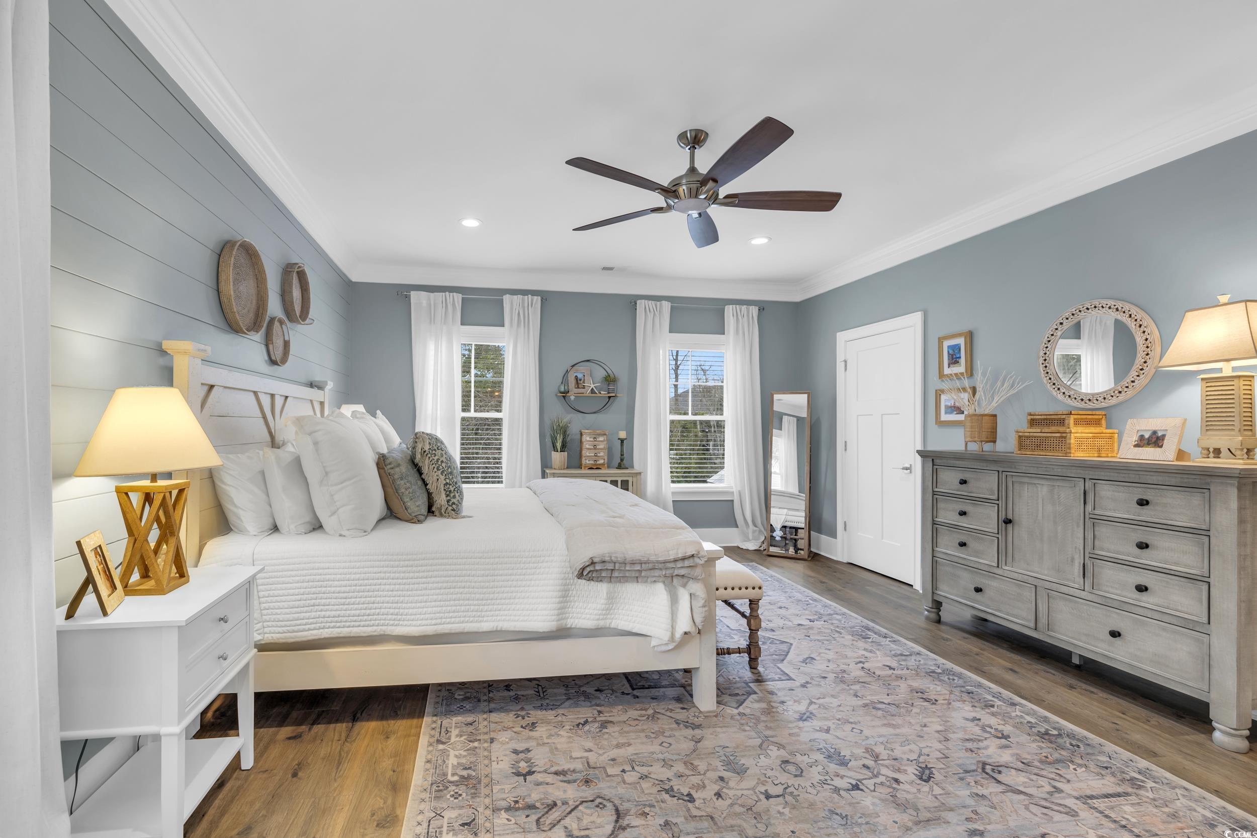 22 Trigger Fish Lane Murrells Inlet, SC 29576 - Photo 17 of 39 Bedroom with ceiling fan, crown molding, and dark wood-type flooring