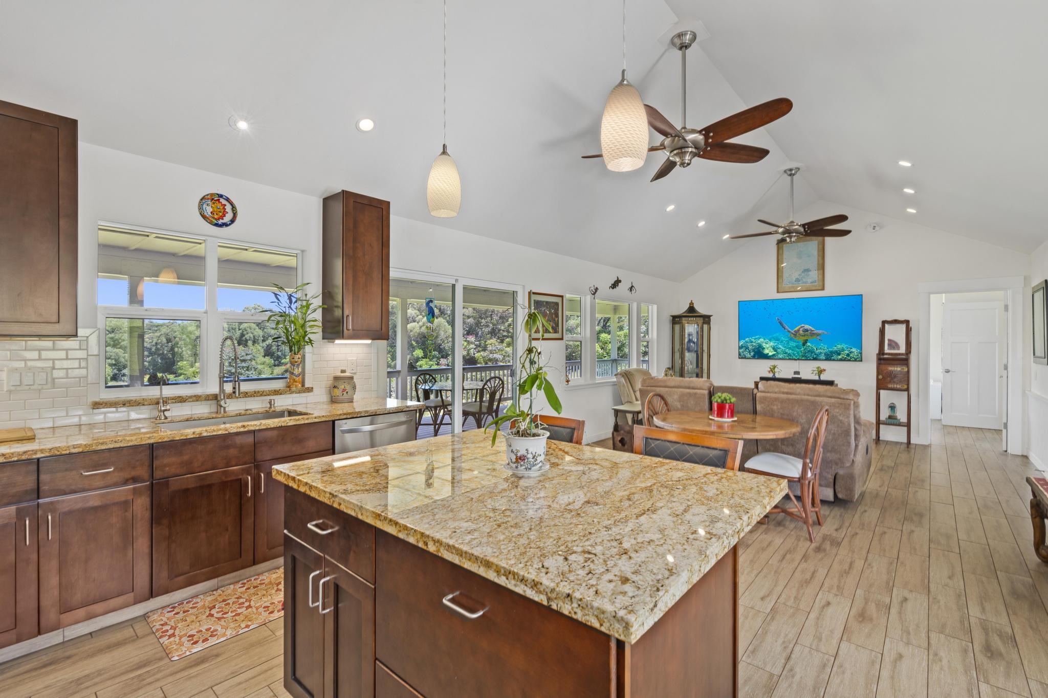 896 Hoomalolo Place, Unit B Haiku, HI 96708 - Photo 19 of 44 a kitchen with a sink a counter top space appliances and a window