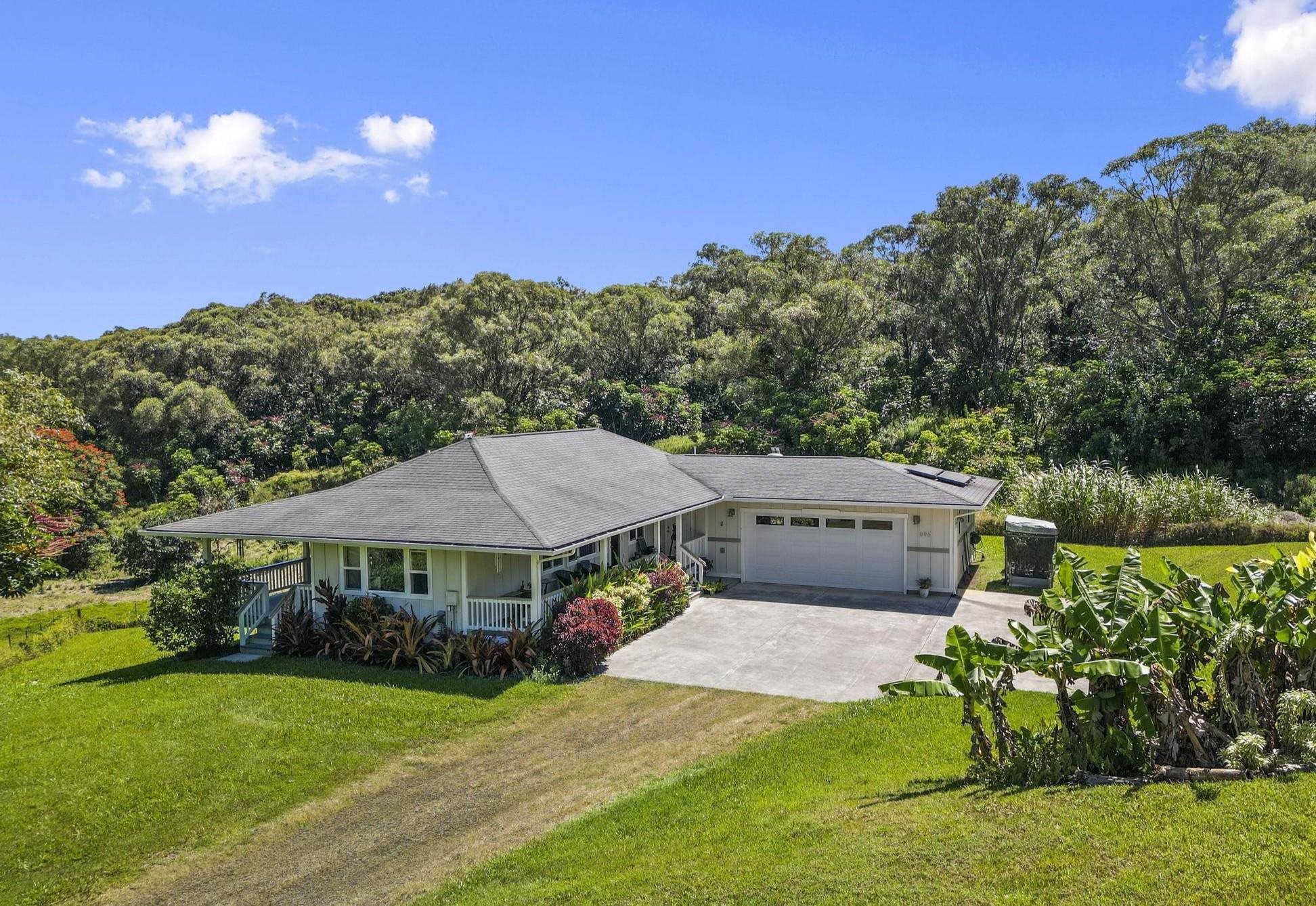 896 Hoomalolo Place, Unit B Haiku, HI 96708 - Photo 2 of 44 a view of a house with garden and a sitting area