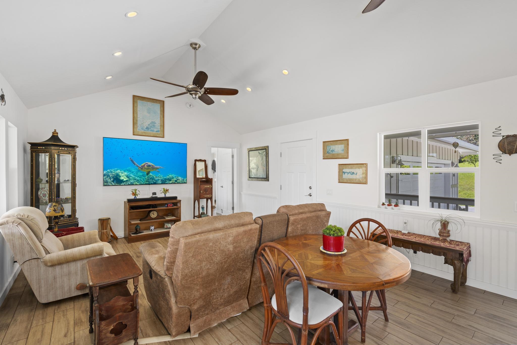 896 Hoomalolo Place, Unit B Haiku, HI 96708 - Photo 21 of 44 a living room with furniture a flat screen tv and a table