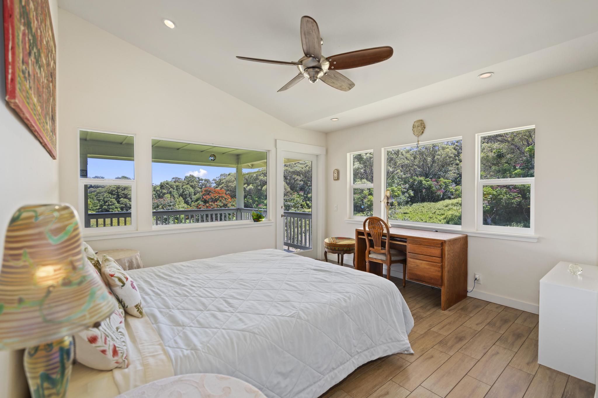 896 Hoomalolo Place, Unit B Haiku, HI 96708 - Photo 23 of 44 a bedroom with a large bed and a large window