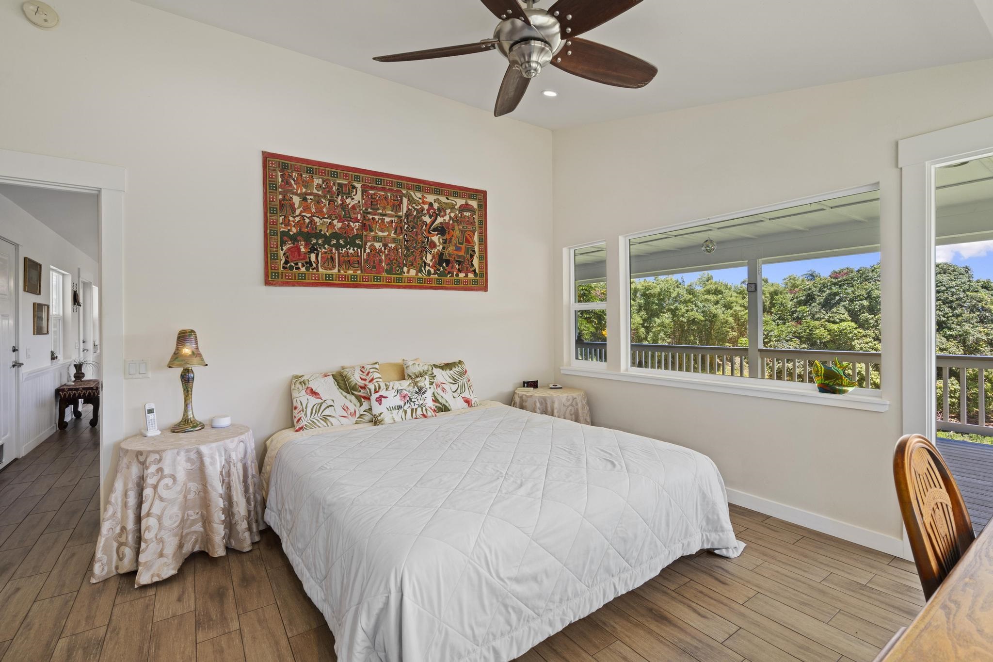 896 Hoomalolo Place, Unit B Haiku, HI 96708 - Photo 24 of 44 a bedroom with a bed and a window