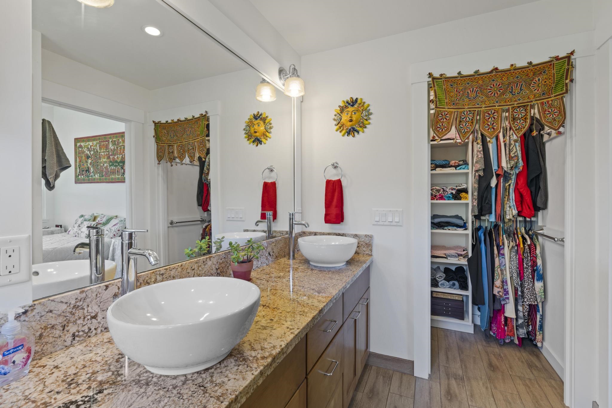 896 Hoomalolo Place, Unit B Haiku, HI 96708 - Photo 27 of 44 a bathroom with a granite countertop tub and a sink