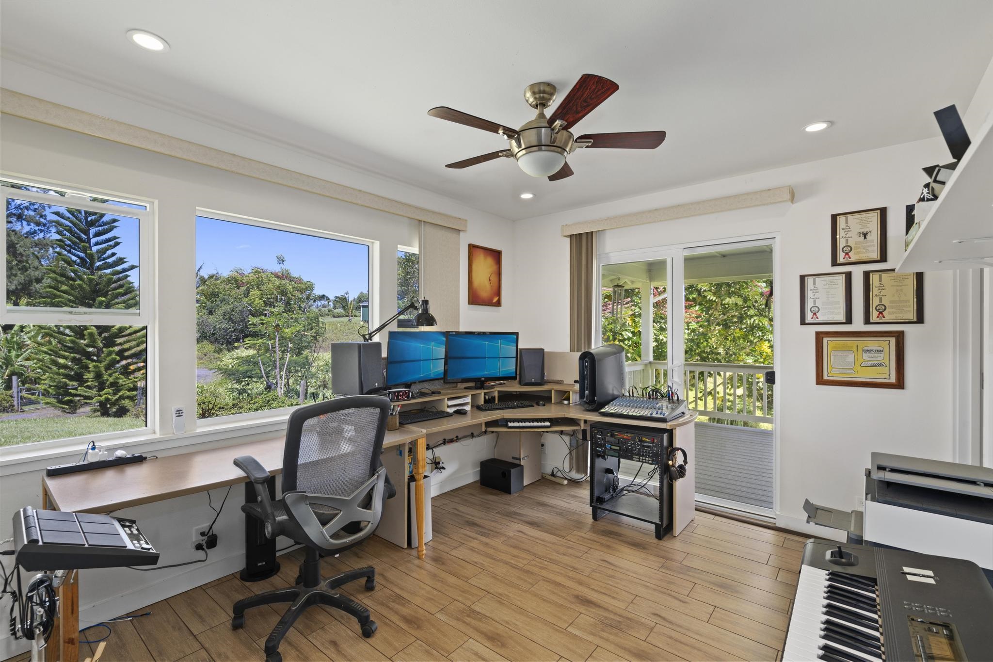 896 Hoomalolo Place, Unit B Haiku, HI 96708 - Photo 28 of 44 a workspace with wooden floor and a window