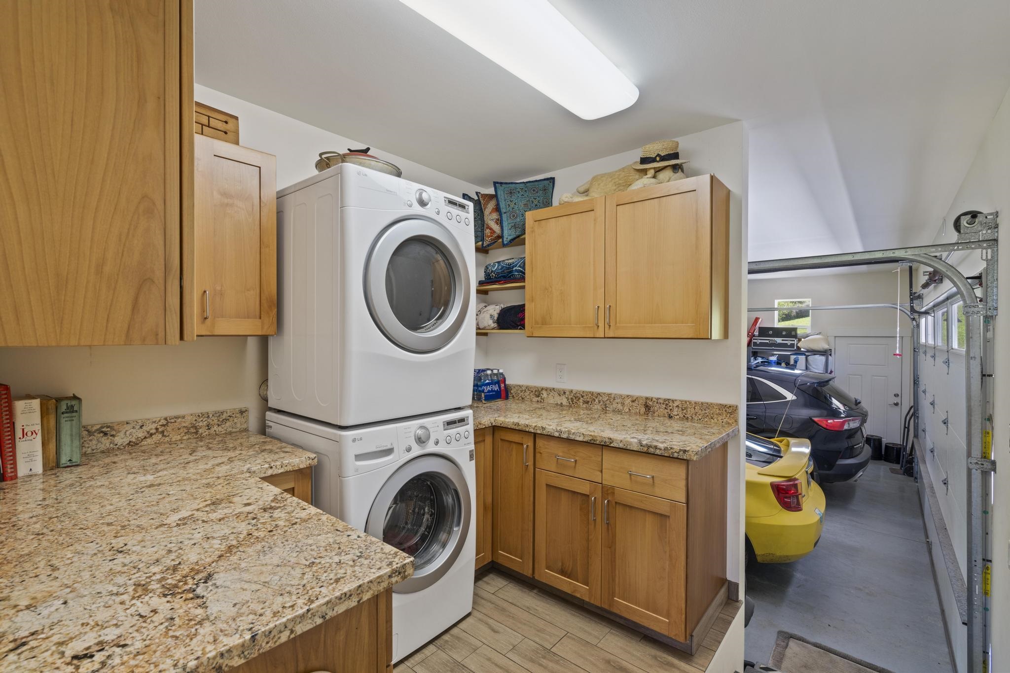 896 Hoomalolo Place, Unit B Haiku, HI 96708 - Photo 31 of 44 a utility room with dryer and washer