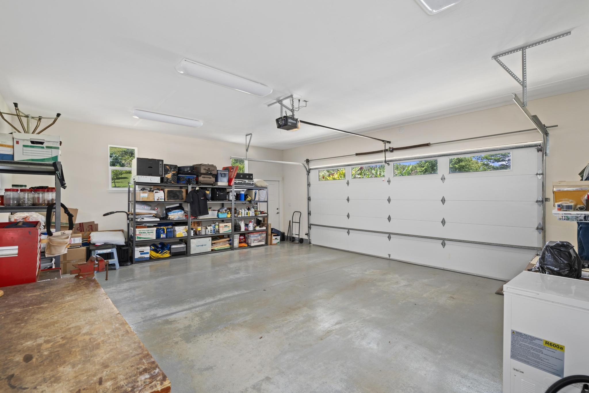 896 Hoomalolo Place, Unit B Haiku, HI 96708 - Photo 33 of 44 a view of a garage with storage