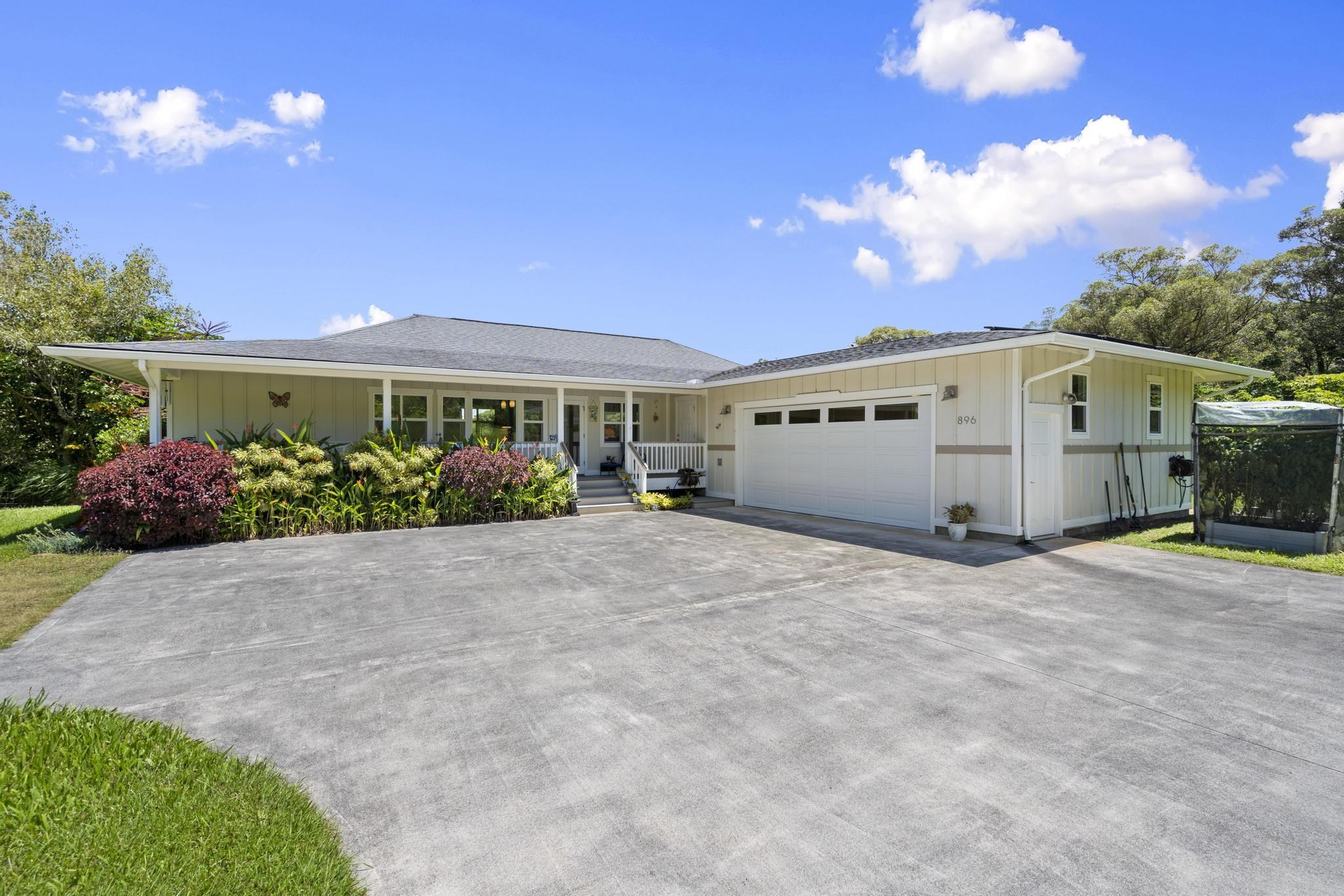 896 Hoomalolo Place, Unit B Haiku, HI 96708 - Photo 4 of 44 a view of a house with backyard and garden