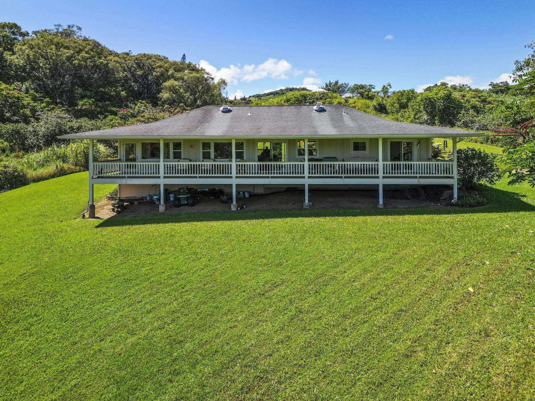 896 Hoomalolo Place, Unit B Haiku, HI 96708 - Photo 5 of 44 a view of a house with a big yard