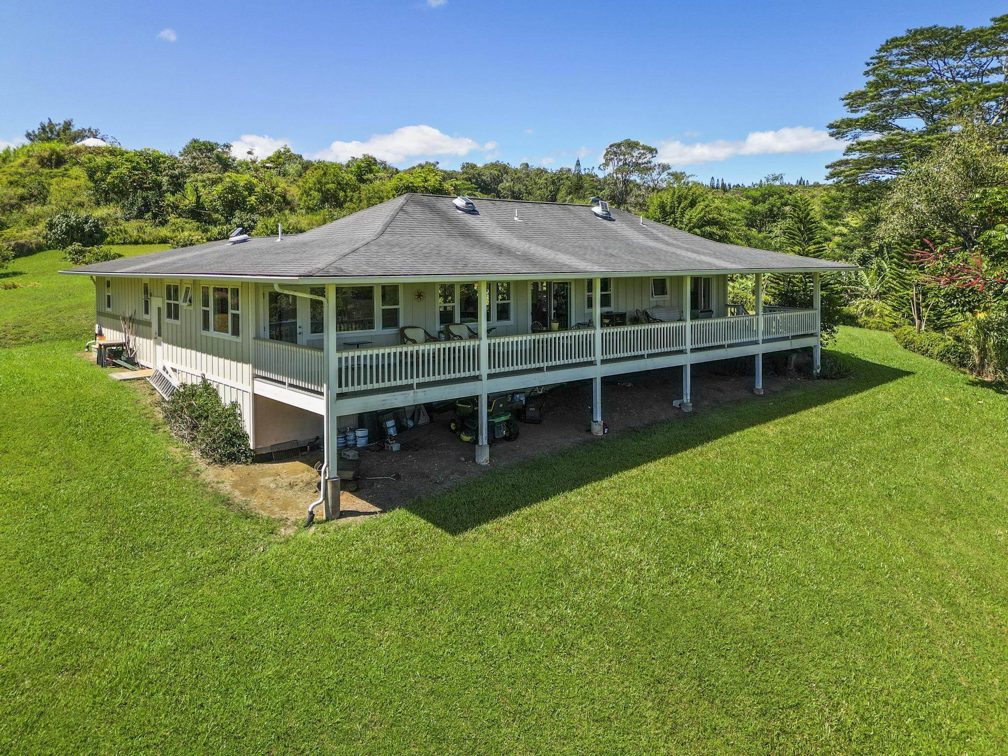 896 Hoomalolo Place, Unit B Haiku, HI 96708 - Photo 6 of 44 a front view of a house with a garden