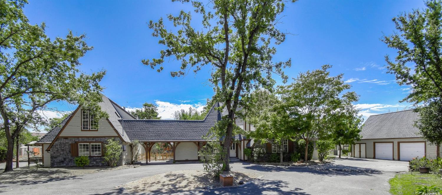 630 Hunter Lane Santa Rosa, CA 95404 - Photo 1 of 1 a front view of a house with a garden
