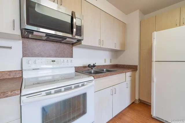a kitchen with a stove and a microwave