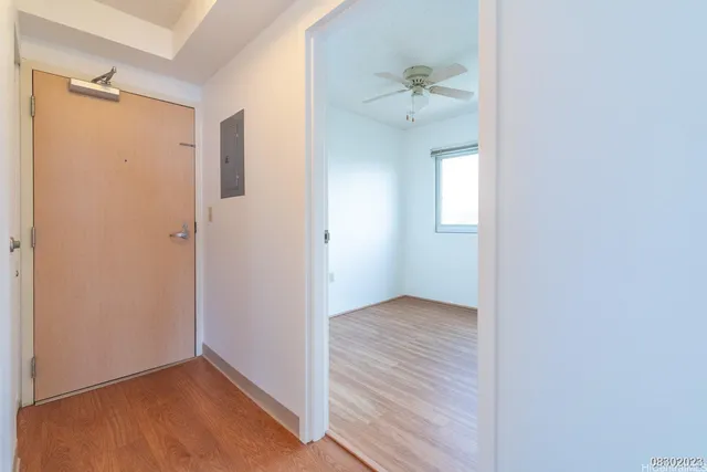 an empty room that has a window in it