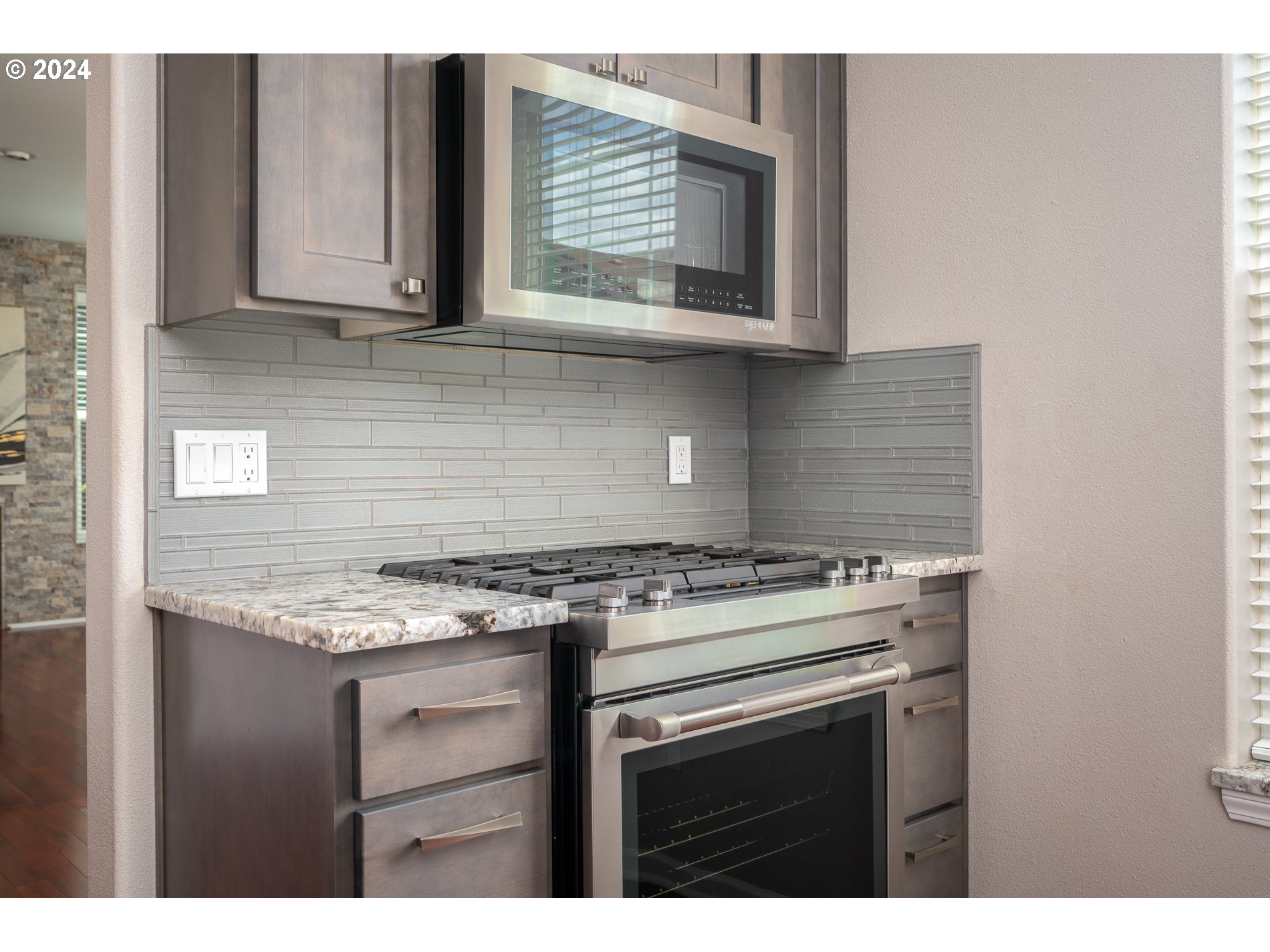 2395 Snowberry Ridge Court West Linn, OR 97068 - Photo 11 of 37 a kitchen with stainless steel appliances granite countertop a stove a sink and white cabinets