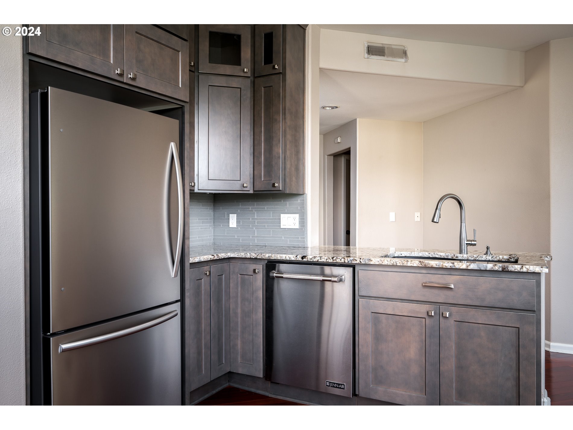 2395 Snowberry Ridge Court West Linn, OR 97068 - Photo 12 of 37 a kitchen with stainless steel appliances granite countertop a refrigerator and a sink