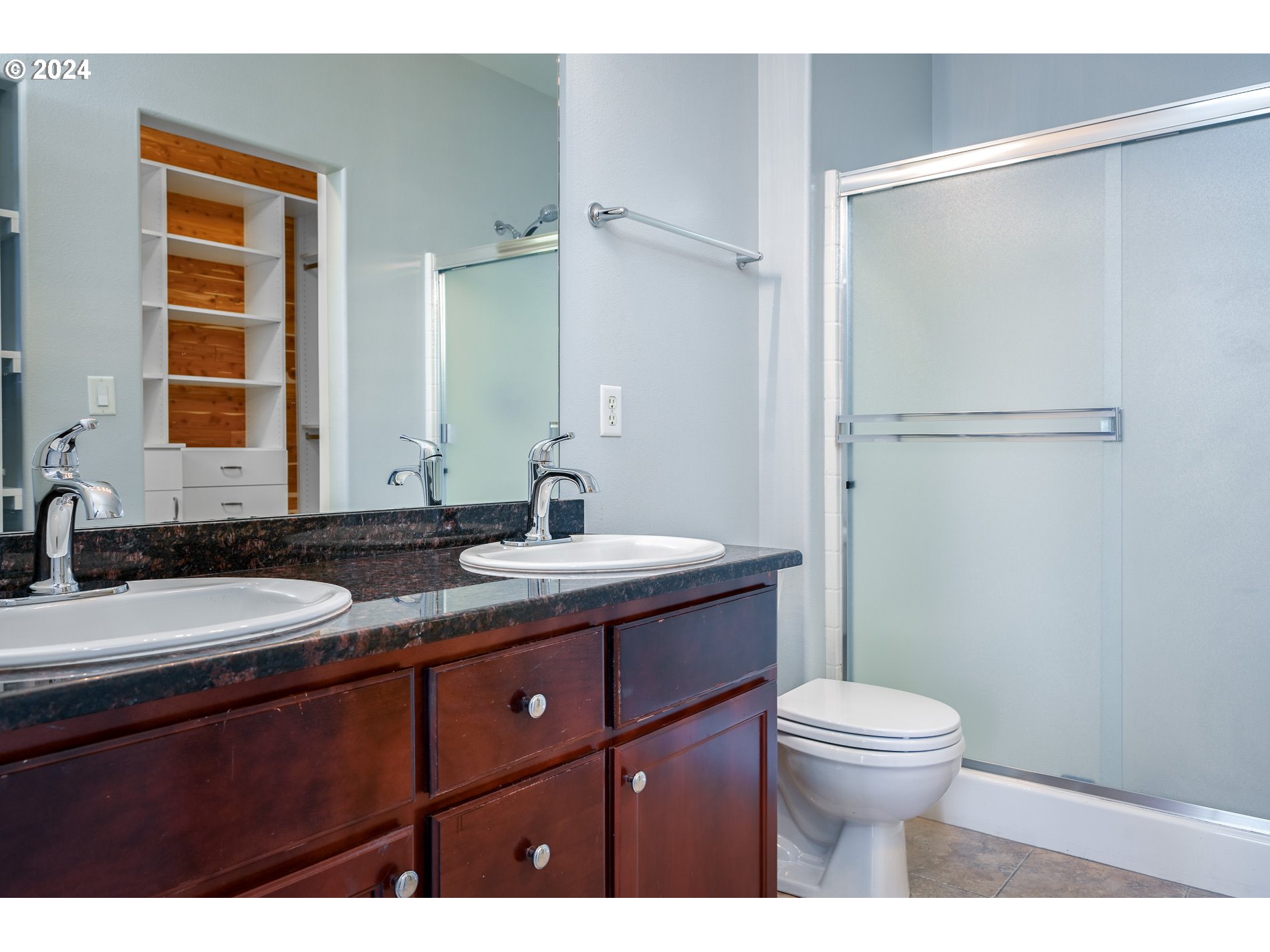 2395 Snowberry Ridge Court West Linn, OR 97068 - Photo 16 of 37 a bathroom with a granite countertop sink toilet a mirror a vanity and shower