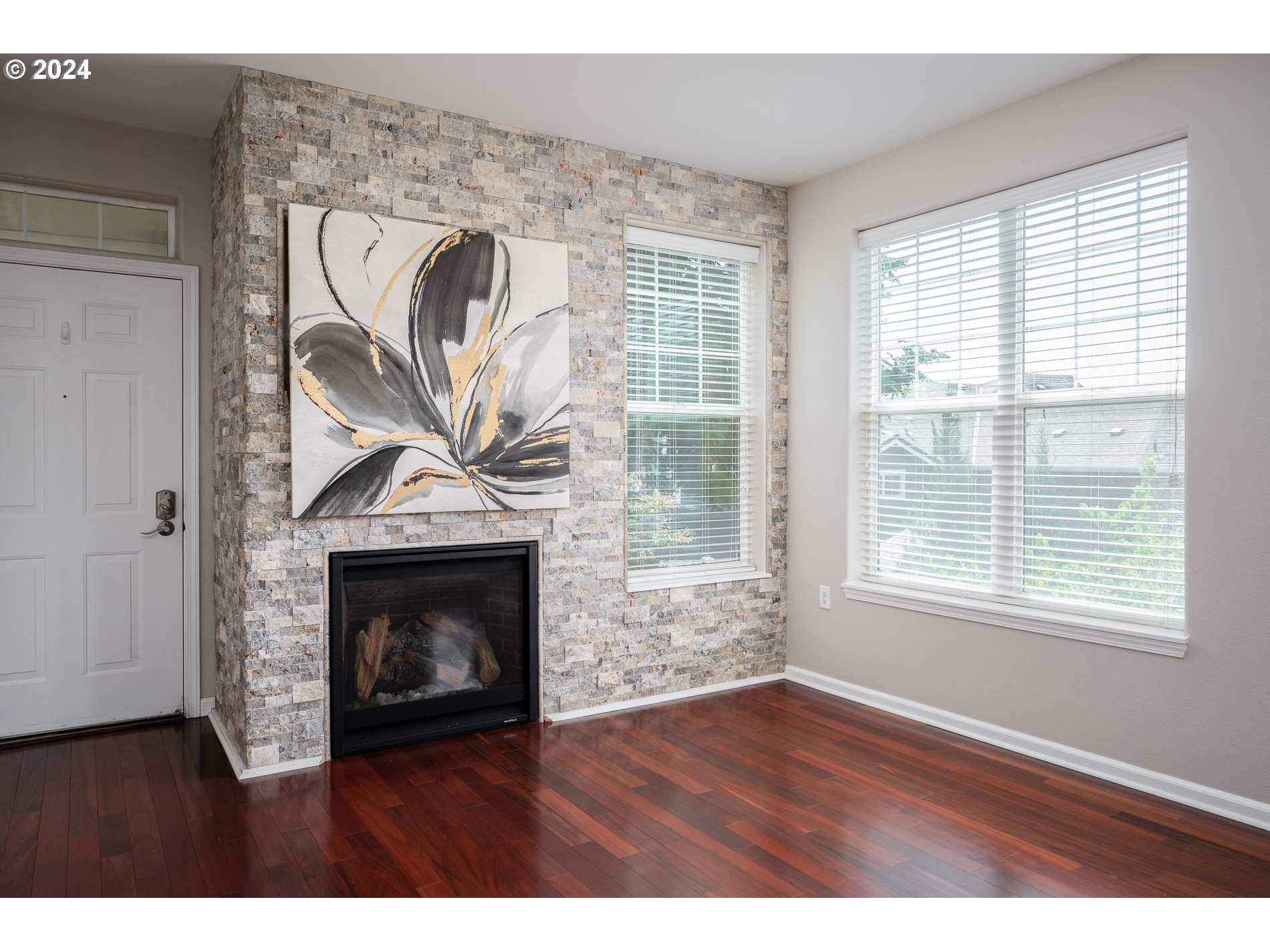 2395 Snowberry Ridge Court West Linn, OR 97068 - Photo 2 of 37 a view of empty room with wooden floor and a fireplace