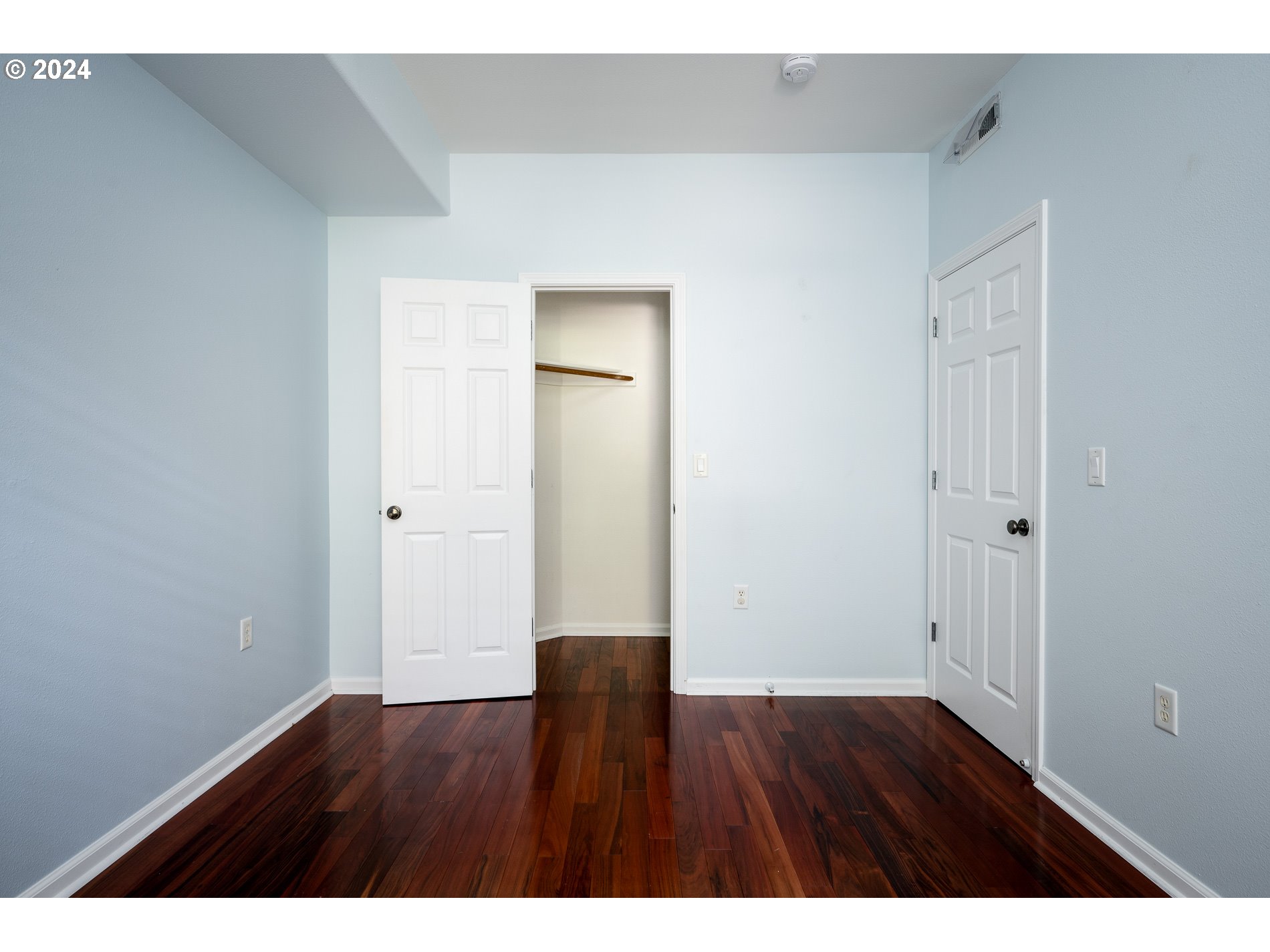 2395 Snowberry Ridge Court West Linn, OR 97068 - Photo 21 of 37 a view of an empty room with wooden floor