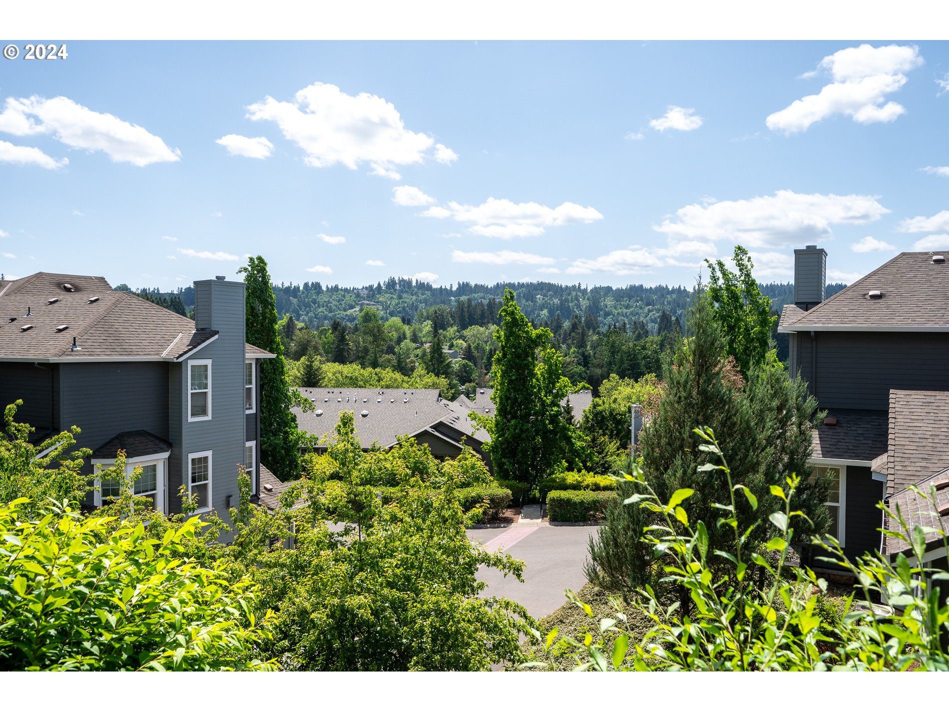 2395 Snowberry Ridge Court West Linn, OR 97068 - Photo 28 of 37 a view of a house with a garden and a yard
