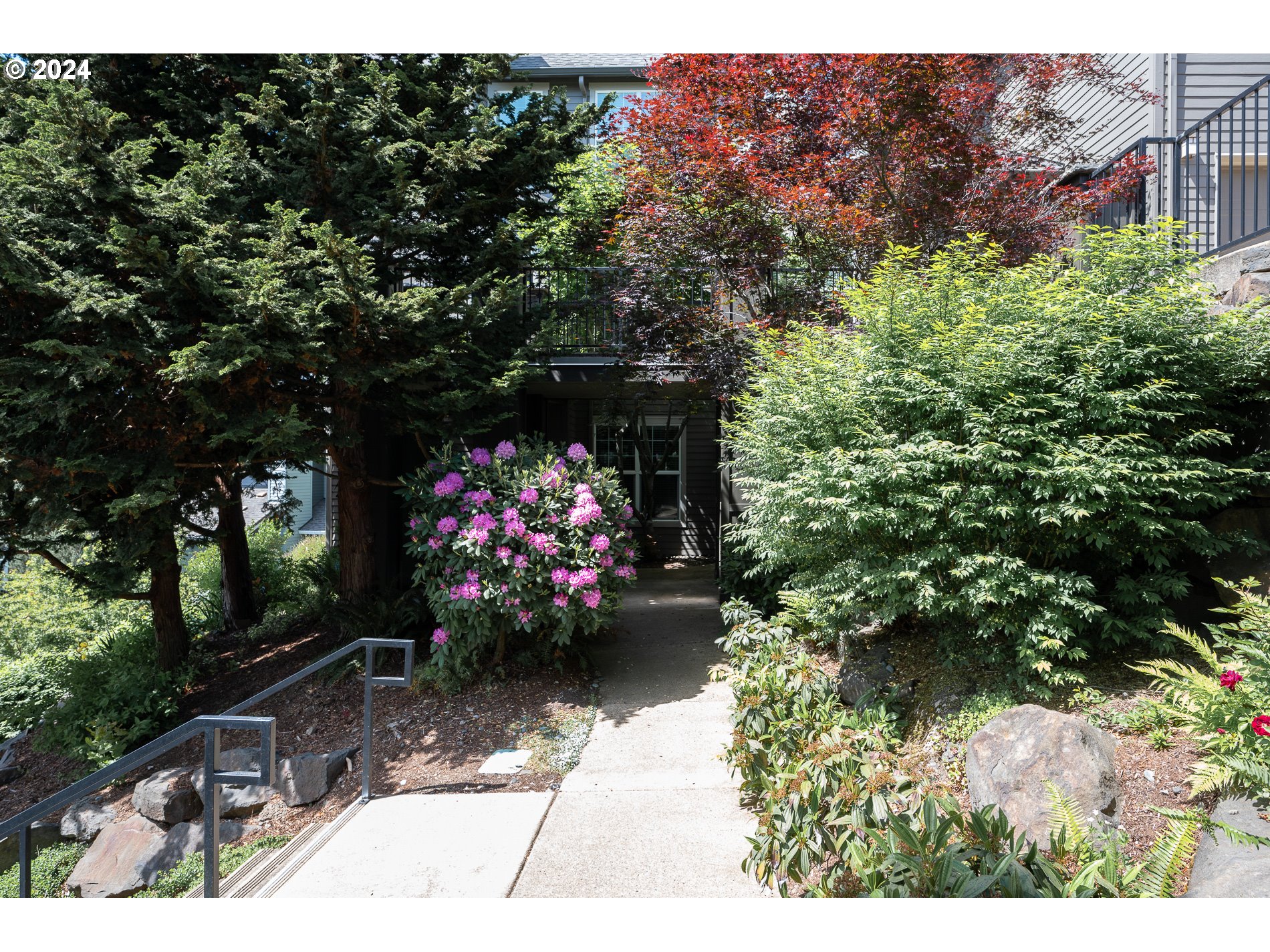 2395 Snowberry Ridge Court West Linn, OR 97068 - Photo 35 of 37 a view of a garden with flowers