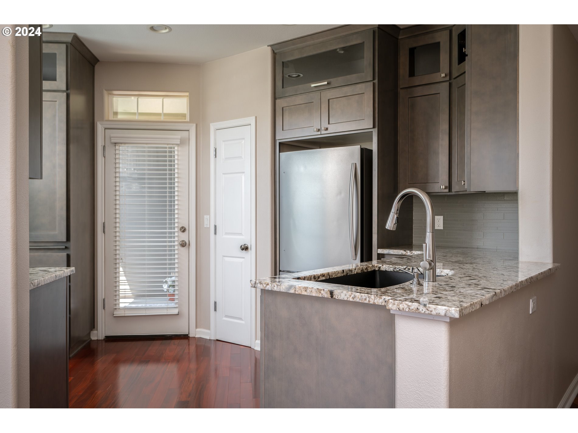 2395 Snowberry Ridge Court West Linn, OR 97068 - Photo 5 of 37 a kitchen with granite countertop a refrigerator and a sink