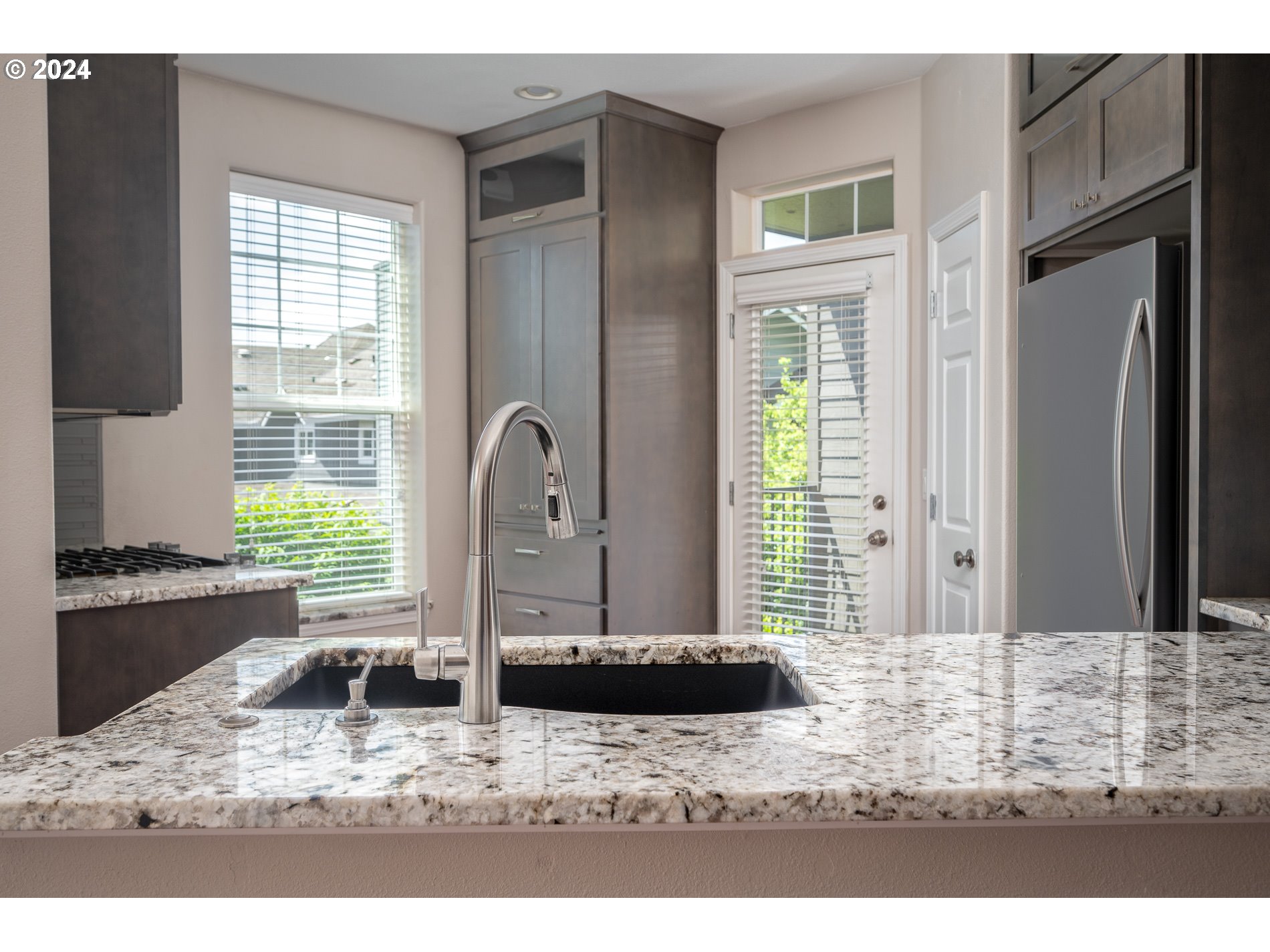 2395 Snowberry Ridge Court West Linn, OR 97068 - Photo 6 of 37 a view of a kitchen with a window