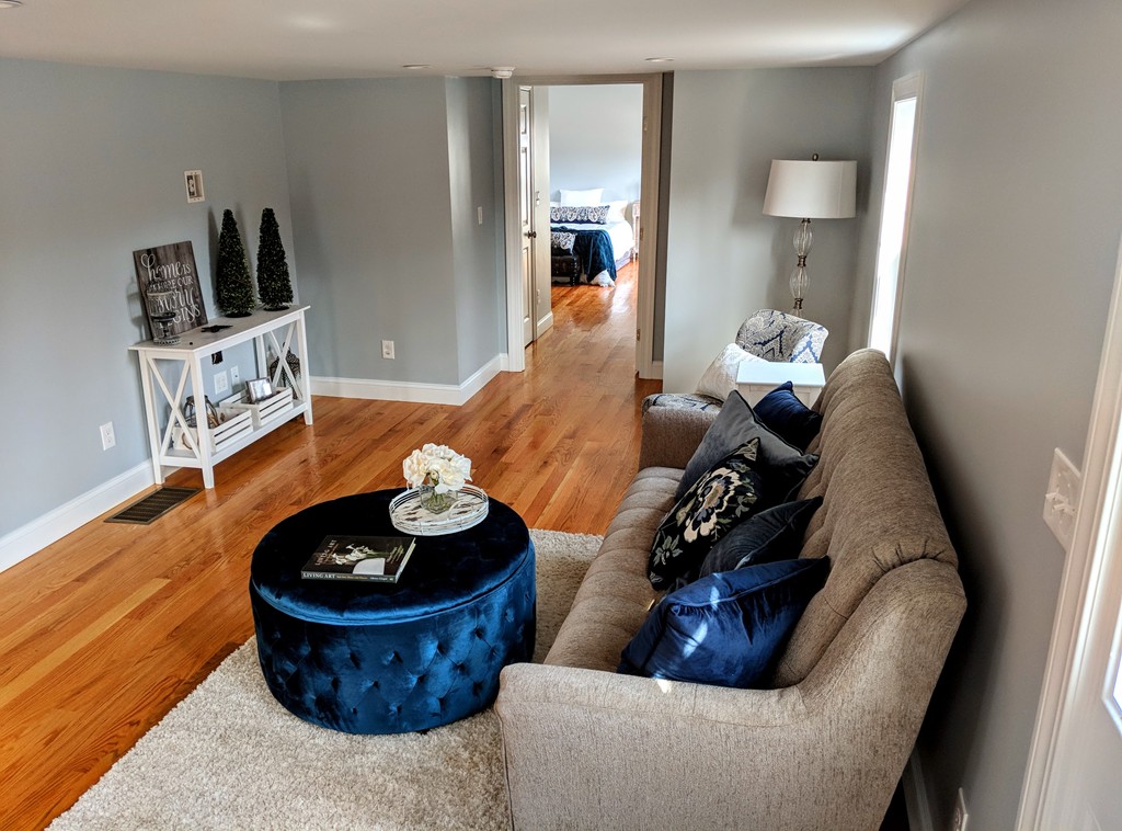 396 Reed Road Dartmouth, MA 02747 - Photo 3 of 13 a living room with furniture and a wooden floor