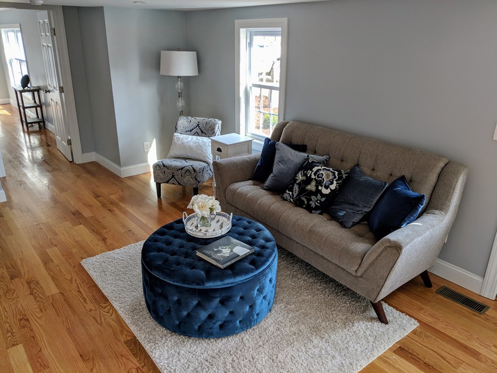 396 Reed Road Dartmouth, MA 02747 - Photo 4 of 13 a living room with furniture and wooden floor