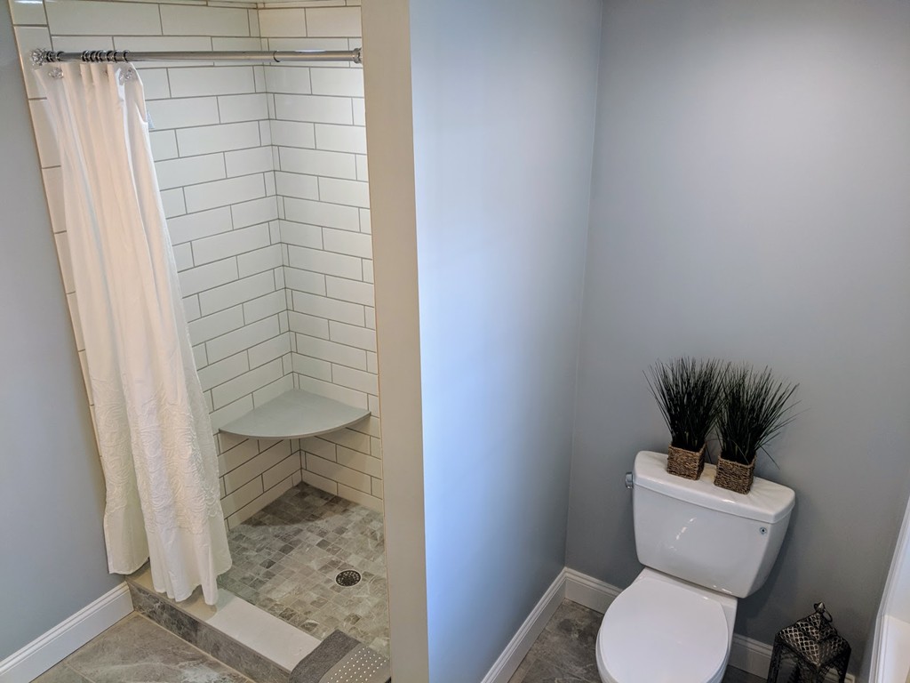 396 Reed Road Dartmouth, MA 02747 - Photo 7 of 13 a bathroom with a toilet and a shower