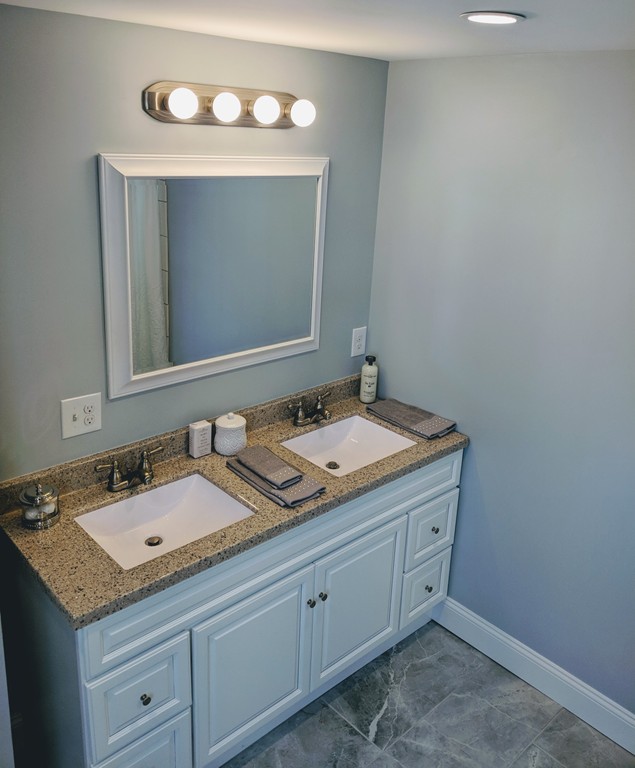 396 Reed Road Dartmouth, MA 02747 - Photo 8 of 13 a bathroom with a granite countertop sink and a mirror