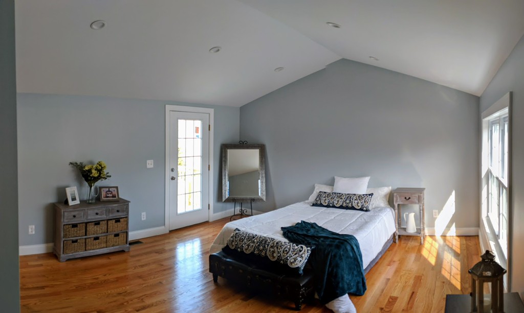 396 Reed Road Dartmouth, MA 02747 - Photo 9 of 13 a bedroom with a bed and wooden floor