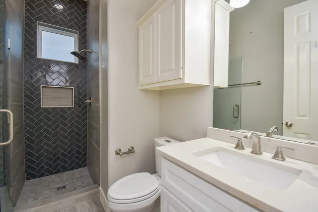 a spacious bathroom with shower bathtub and window
