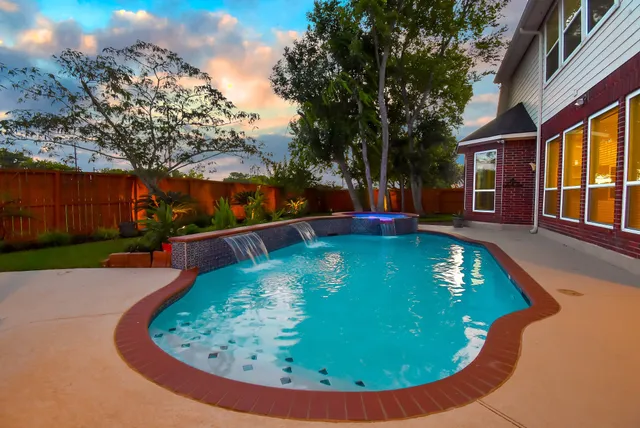 front view of a house with a swimming pool