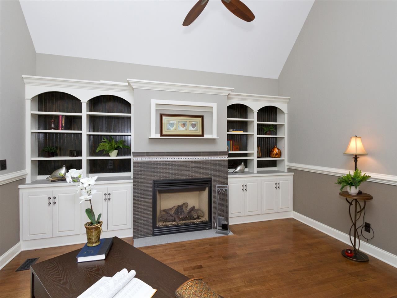 7220 Sparhawk Road Wake Forest, NC 27587 - Photo 11 of 25 Custom Tiled Gas Fireplace and Built-In Bookcases