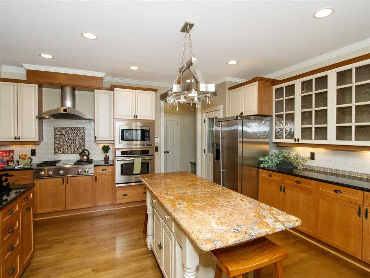 7220 Sparhawk Road Wake Forest, NC 27587 - Photo 3 of 25 Granite Counters, Stainless Appliances and Gas Stovetop Make this Kitchen a Chef's Dream