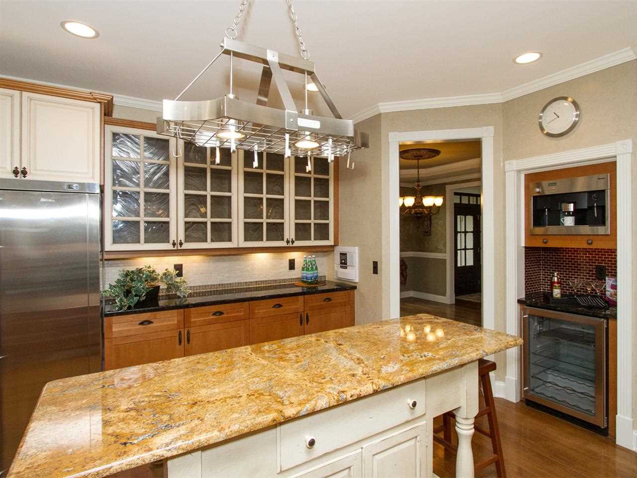 7220 Sparhawk Road Wake Forest, NC 27587 - Photo 4 of 25 Built in Miele Coffee Maker and Wine Refrigerator are Custom Touches