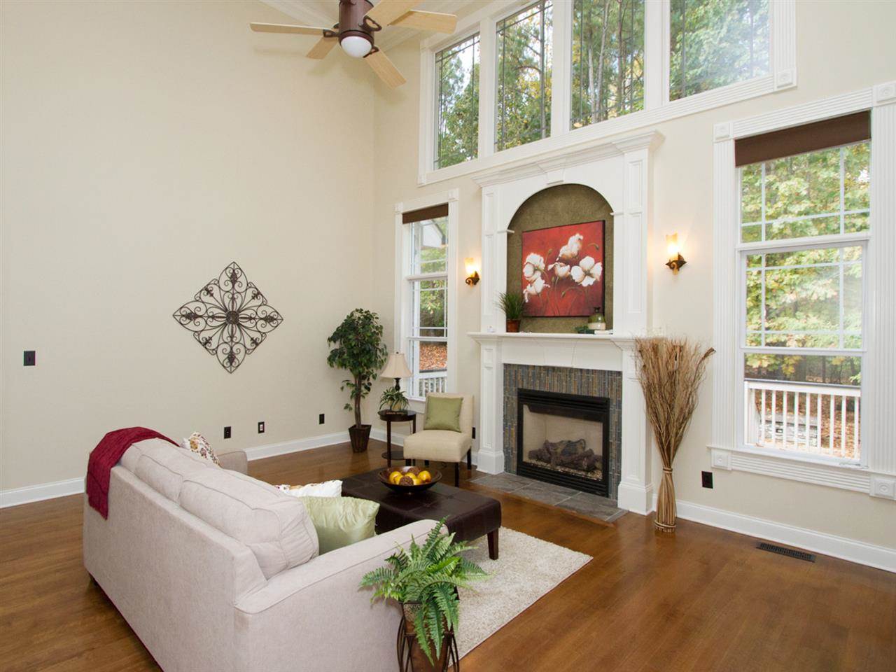 7220 Sparhawk Road Wake Forest, NC 27587 - Photo 8 of 25 Custom Mantle on the Gas Fireplace and Abundance of Natural Light