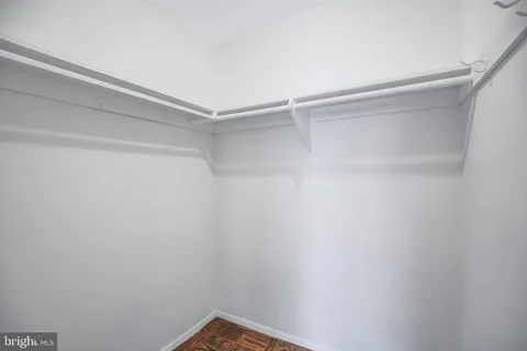 a view of a room with shelf on the wall