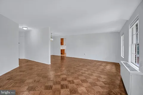 a view of an empty room with windows