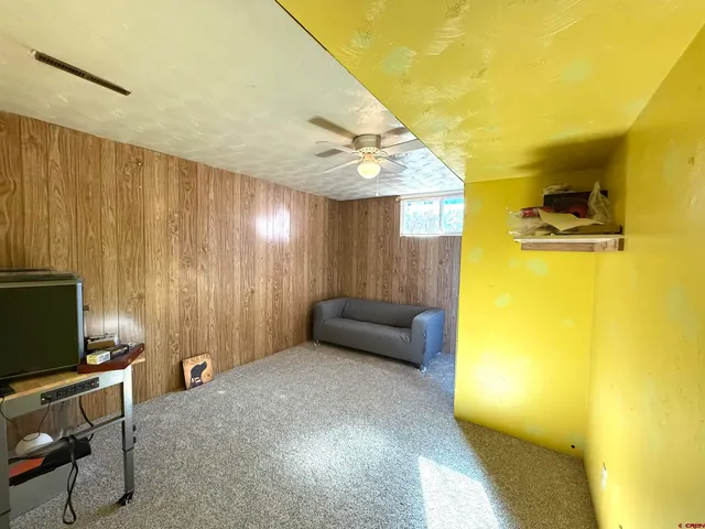 a view of a livingroom with furniture and a flat screen tv
