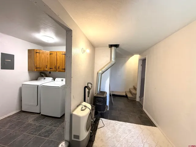 a bathroom with a sink a mirror and a shower