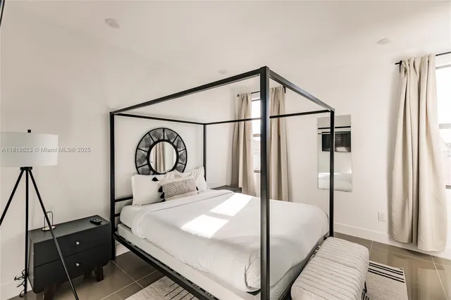 a bedroom with a bed and a dresser