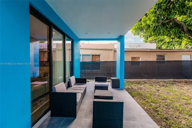 a view of outdoor sitting area with furniture